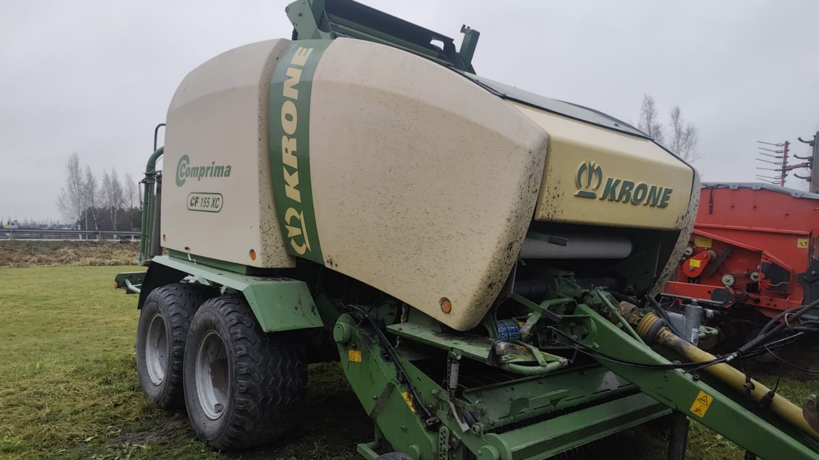 Пресс-подборщик рулонный с обмотчиком Krone Comprima CF 155 XC